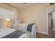 Cozy bedroom featuring twin beds, natural lighting, and neutral decor for a relaxing atmosphere at 5270 Miller Bayou Dr, Port Richey, FL 34668