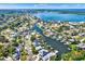 Aerial view of a waterfront community with lush landscaping, canals, and stunning water views at 5331 Bayou Grande Ne Blvd, St Petersburg, FL 33703