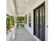Inviting balcony featuring double doors and classic white railings perfect for enjoying a relaxed atmosphere at 5331 Bayou Grande Ne Blvd, St Petersburg, FL 33703