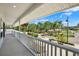 Balcony view showcasing the neighborhood and lush greenery from this charming home at 5331 Bayou Grande Ne Blvd, St Petersburg, FL 33703