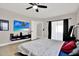 Bright bedroom with a large window and a modern entertainment center with tv at 5331 Bayou Grande Ne Blvd, St Petersburg, FL 33703