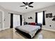 Bright bedroom with a large window with black drapes and decorative elements at 5331 Bayou Grande Ne Blvd, St Petersburg, FL 33703