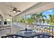 Expansive deck overlooking a waterway with plush outdoor seating and ceiling fans at 5331 Bayou Grande Ne Blvd, St Petersburg, FL 33703