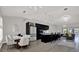 Modern open-concept kitchen with sleek black cabinetry, stainless steel appliances, and stylish dining area at 5331 Bayou Grande Ne Blvd, St Petersburg, FL 33703