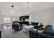 Open-concept living room with modern furnishings and adjacent kitchen and dining areas at 5331 Bayou Grande Ne Blvd, St Petersburg, FL 33703