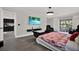 Main bedroom with TV, balcony access and modern decor at 5331 Bayou Grande Ne Blvd, St Petersburg, FL 33703