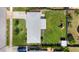 An aerial view of the property featuring a fenced yard, a playset, and a storage shed at 5961 41St N Ave, St Petersburg, FL 33709