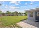 Spacious backyard with a play set, a privacy fence, and a storage shed at 5961 41St N Ave, St Petersburg, FL 33709
