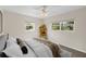 Sunlit bedroom with modern decor, plush bedding, and bright windows at 5961 41St N Ave, St Petersburg, FL 33709