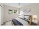 Bedroom with a plush bed, stylish bedding, and a bright window at 5961 41St N Ave, St Petersburg, FL 33709