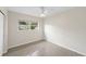 Bedroom with a neutral color scheme and view to the exterior at 5961 41St N Ave, St Petersburg, FL 33709