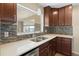 Bright kitchen showcases a dual basin sink, stone countertops and mosaic backsplash at 5961 41St N Ave, St Petersburg, FL 33709