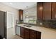 Updated kitchen features stainless steel appliances, mosaic backsplash, and ample counter space at 5961 41St N Ave, St Petersburg, FL 33709