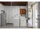 Basement laundry area with washer, dryer, and utility sink; adjacent to storage area at 5961 41St N Ave, St Petersburg, FL 33709