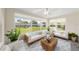 Bright living room with polished concrete floors, modern furnishings, and lots of natural light at 5961 41St N Ave, St Petersburg, FL 33709
