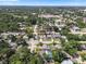 Aerial view of the property showcasing its location in a neighborhood with mature trees and nearby amenities at 6006 114Th N Ter, Pinellas Park, FL 33782