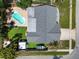 Birds eye view of backyard with pool, boat parking, fenced yard, and artificial turf at 6006 114Th N Ter, Pinellas Park, FL 33782