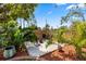 Secluded seating area with white rock and lush landscaping. Perfect for relaxing! at 6006 114Th N Ter, Pinellas Park, FL 33782