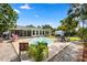 Spacious backyard featuring an in-ground pool, patio, and lush landscaping at 6006 114Th N Ter, Pinellas Park, FL 33782