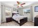 Cozy bedroom with a comfortable bed, wood-look floors, and natural light creating a relaxing atmosphere at 6006 114Th N Ter, Pinellas Park, FL 33782