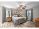 Spacious bedroom with wood floors, ceiling fan, and two large windows at 6006 114Th N Ter, Pinellas Park, FL 33782