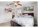 Comfortable bedroom featuring a wood-look ceiling fan, flooring and soft natural light creating a relaxing atmosphere at 6006 114Th N Ter, Pinellas Park, FL 33782