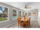 Dining room has wood floors, a wood table with views of the pool at 6006 114Th N Ter, Pinellas Park, FL 33782