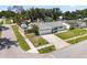Aerial view of a well-maintained home with a lush green lawn and a private driveway at 6006 114Th N Ter, Pinellas Park, FL 33782