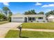 Charming one-story home featuring a well-manicured lawn and a classic mailbox at 6006 114Th N Ter, Pinellas Park, FL 33782