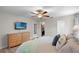 Comfortable main bedroom with closet access, light wood floors, and ceiling fan at 6006 114Th N Ter, Pinellas Park, FL 33782