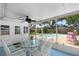 Screened-in patio offering serene views of the outdoor pool and beautifully landscaped yard at 6006 114Th N Ter, Pinellas Park, FL 33782