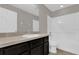 This bathroom features a shower and vanity with solid surface countertop at 6924 Towne Lake Rd, Riverview, FL 33578