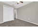 This carpeted bedroom includes a closet and neutral walls at 6924 Towne Lake Rd, Riverview, FL 33578