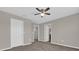 This bedroom features neutral walls, carpeted floor, and ceiling fan at 6924 Towne Lake Rd, Riverview, FL 33578