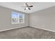 This is a bedroom with a ceiling fan, neutral paint, and carpeted floor at 6924 Towne Lake Rd, Riverview, FL 33578