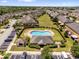 Aerial view of a community pool and recreation center, nestled within lush landscaping at 6924 Towne Lake Rd, Riverview, FL 33578