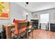 Stylish dining area with modern furniture, hardwood floors, and bright natural light at 6960 Sunset S Dr # 2B, South Pasadena, FL 33707