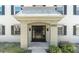 Inviting front entrance of home with black door, stylish lighting, and elegant architectural details at 6960 Sunset S Dr # 2B, South Pasadena, FL 33707