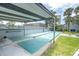 Outdoor shuffleboard courts with shade canopy, providing residents an entertaining recreational amenity at 6960 Sunset S Dr # 2B, South Pasadena, FL 33707