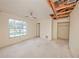 A bedroom with an open ceiling and closet space at 7033 Wentworth Way, New Port Richey, FL 34655