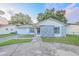 Single-story home featuring stone accents and a well-manicured lawn at 7033 Wentworth Way, New Port Richey, FL 34655