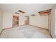 Spacious living room features an open ceiling and deteriorated finishes at 7033 Wentworth Way, New Port Richey, FL 34655