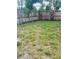 Spacious backyard with a wood fence and plenty of room for outdoor activities at 72 Lake Shore Dr, Palm Harbor, FL 34684