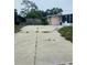 Long driveway provides ample parking space at this property at 72 Lake Shore Dr, Palm Harbor, FL 34684