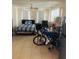 Cozy living area with tile flooring, comfortable furniture, and natural light at 72 Lake Shore Dr, Palm Harbor, FL 34684