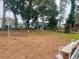 Community playground featuring swings, slides, and a bench for relaxation at 72 Lake Shore Dr, Palm Harbor, FL 34684