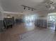 Spacious living room with tile flooring and partially renovated walls at 7832 3Rd S Ave, St Petersburg, FL 33707
