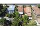 Aerial view of a home with mature trees and well-maintained yard in a quiet neighborhood at 910 E Chelsea St, Tampa, FL 33603