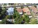Aerial view of a home with mature trees and well-maintained yard in a quiet neighborhood at 910 E Chelsea St, Tampa, FL 33603