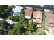 Aerial view of a home with mature trees and well-maintained yard in a quiet neighborhood at 910 E Chelsea St, Tampa, FL 33603